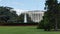 The white house and red flowers and fountain