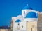 White houses, churches and blue domes in Oia village