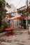 White houses in Greek style. The narrow streets of Bodrum. Homes residents. Colorful umbrellas hanging upside down. Small red wood