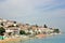 White houses with orange roof, beach and sea view