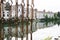 White houses with reflection along river Brenta in Bassano del Grappa, Italy