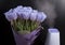 White humidifier with spring flowers on a black background.