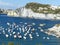 White imposing cliffs in a bay of the island of Ponza in Italy.
