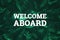 White inscription: welcome aboard, on a green natural background. Concept for motivating background, business, self-development