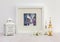 White interior display. Framed hare collaged drawing, blue background.