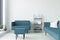 White Interior with Turquoise Sofa, Armchair and Ladder Shelf