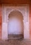White islamic style archway against pink wall
