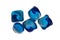 White isolated background and blue soluble capsules with liquid to remove stains from clothes in washing machine.