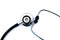 On a white isolated background lies a black stethoscope.