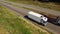 A white isothermal van is moving along the highway