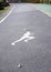 The white jogging man painting on the jogging lane parallel with green bike lane.