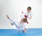 In white judogi athletes train judo throws