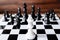 White king chess on the board with chess army on wooden background, Leader, challenges planning business strategy to success