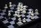 White king in chess game on chessboard. Black and white figure positioning. Chess figurine order. Checkmate game