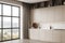White kitchen corner with beige cabinets and window