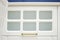 White kitchen facade with glass elements. Part of a stylish kitchen interior