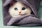 a white kitten with blue eyes peeking out from a blanket on a bed with a green sheet on it