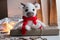 White knitted bull with horns and a red scarf