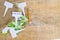 White labels-markers for plants lie on burlap, on wooden  background.