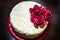 White lace cake with burgundy roses