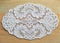 White lace table linen Plauener spitze (Plauen lace) on wooden background