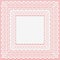 White lacy square doily isolated on a pink background. Openwork lace frame towel mat