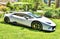 A white Lamborghini Huracan in a garden setting