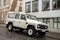 White Land Rover 110 car parked on the street of Iceland prepared for hard work and off road adventures