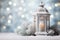 White lantern with candle and decorations on snow