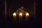 White large candles standing on the fireplace.