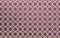 White Lattice forming pattern with squares of Arabic inspiration over violet background
