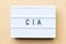 White light box with word CIA abbreviation of certified internal auditor on wood background