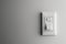 White light switch on a wall