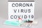 White lightbox with text epidemic coronavirus 2019-nCoV COVID-19 corona virus