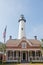 White Lighthouse Behind American Brick House