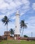 White lighthouse, palm trees, dutch fort in Galle