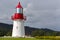 White lighthouse with red roof