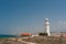 White lighthouse and road