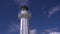 White lighthouse with wind indicator