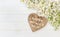 White lilac flowers wooden heart Mothers Day