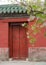 White lilacs in spring, traditional Chinese architectural style red walls