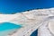 White limestone deposits and a pool at Pamukkale, Turkey