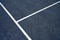 White Line on Blue Grunge Tennis Court Background.