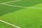 The white Line marking on the artificial green grass soccer field