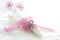 White linen serviette with pink beaded napkin ring