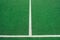 White lines on green soccer or football field. Perpendicular lining.