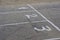 White lines and numbers 1, 2, 3 on the asphalt