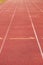 White lines and texture of running racetrack, red rubber racetracks in small stadium