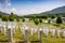 White lines of tombstones as a memorial to Srebrenica massacre in Potocari, Bosnia and Herzegovina