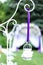 White little lantern hanging on violet ribbon.